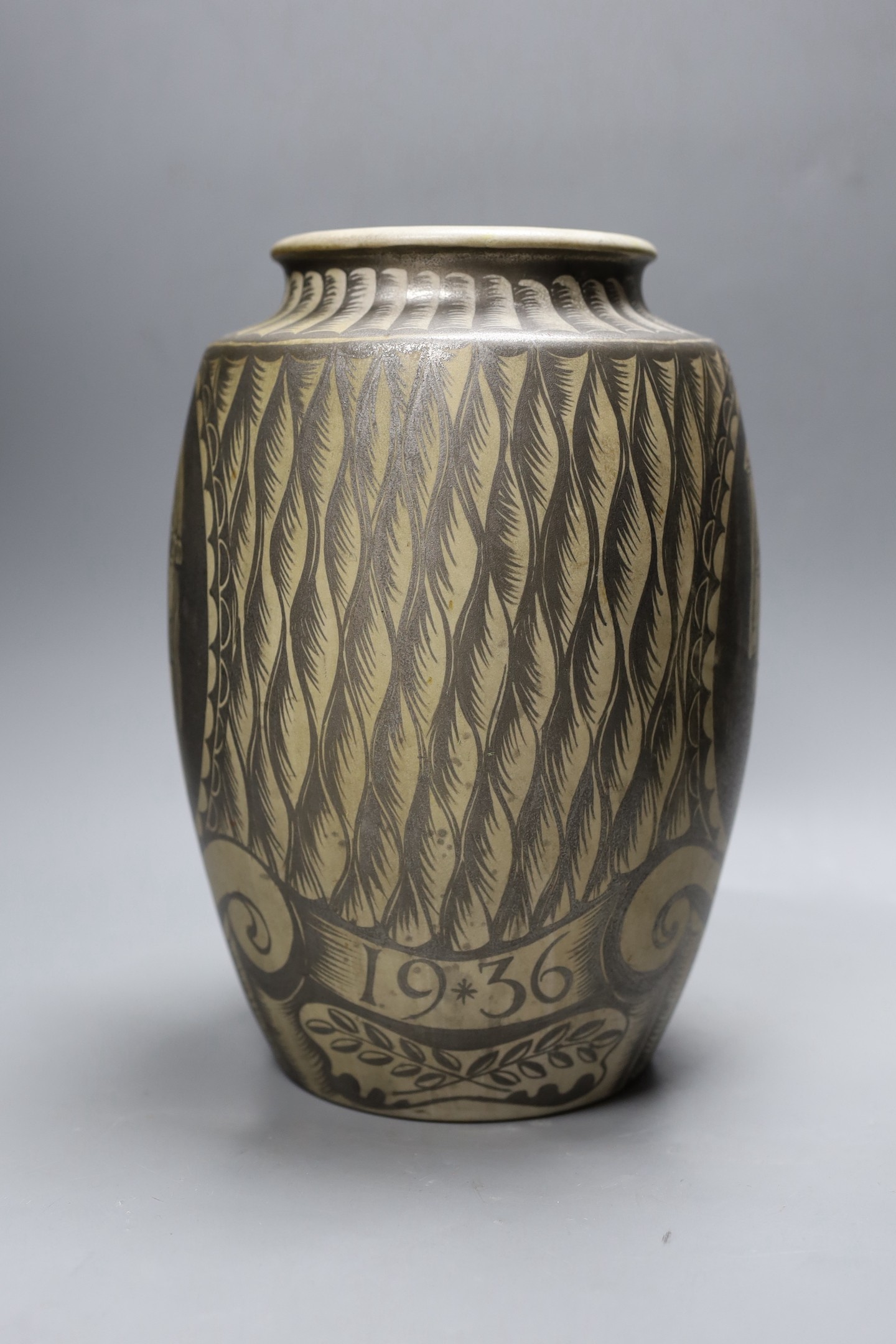 A possibly unique Royal Doulton Lambeth stoneware silver lustre vase, c.1936, painted with Greek style heads on a feather ground, inscribed ‘A*E*B 1936’, impressed marks to base, 30.5 cm high